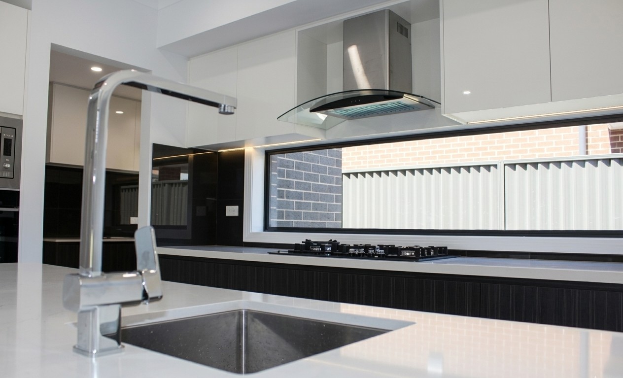 Kitchen tap and sink detail in a rebuilt Elegant Homes NSW home